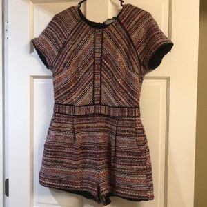 Adelyn Rae colorful romper with leather lining.